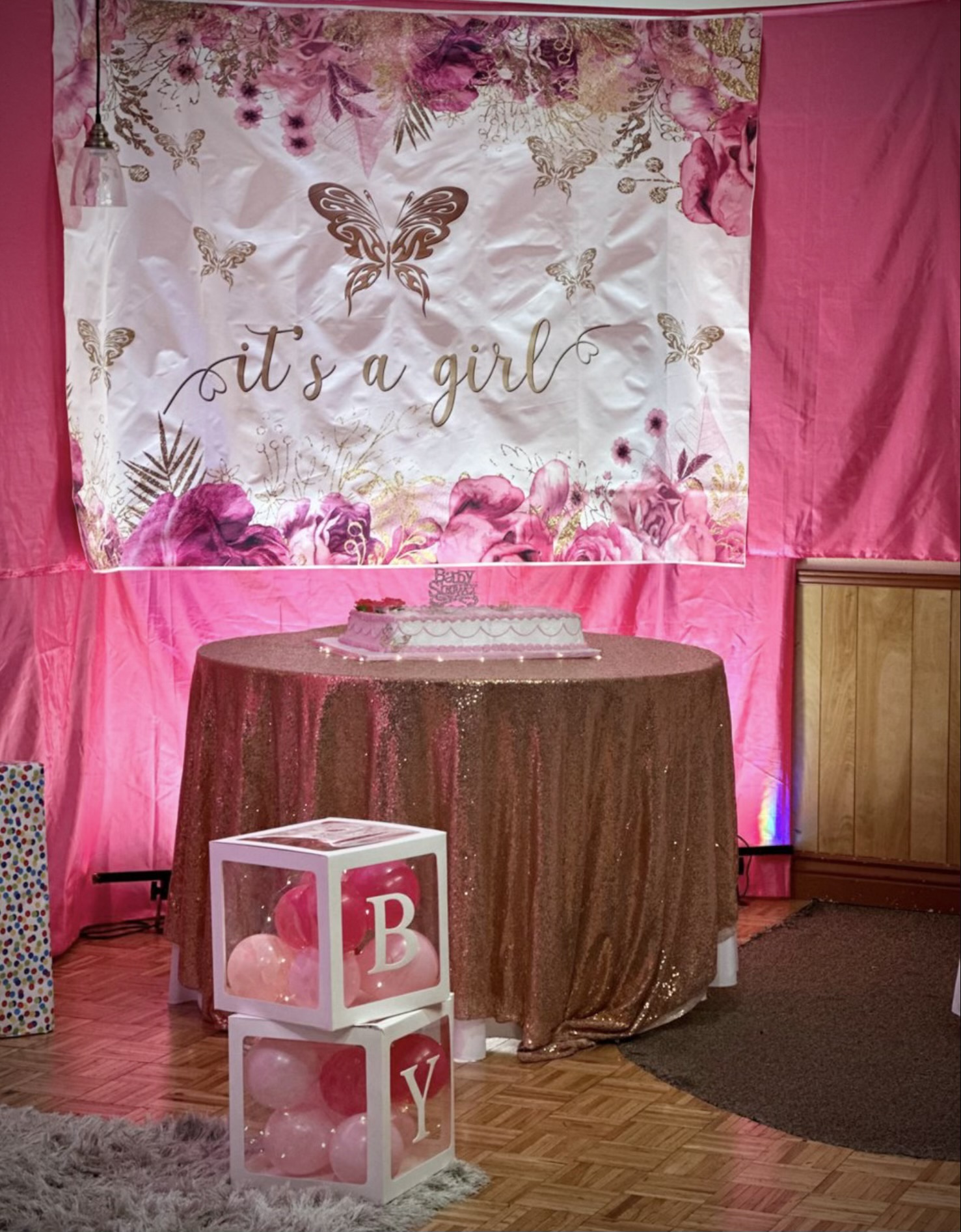 It's a Girl baby shower with pink backdrop and blocks