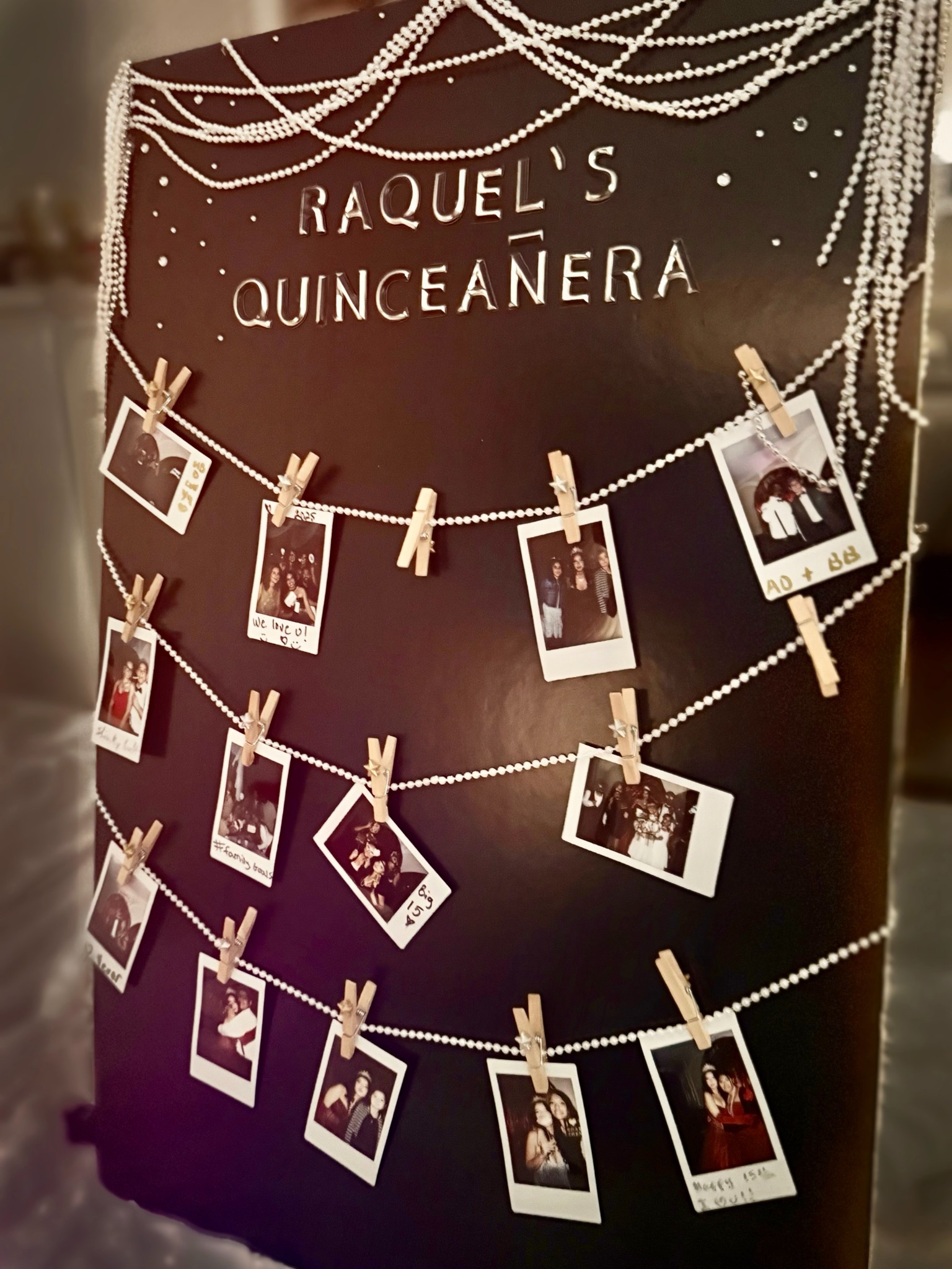 Gatsby red & gold photo wall with pearls and instant photos