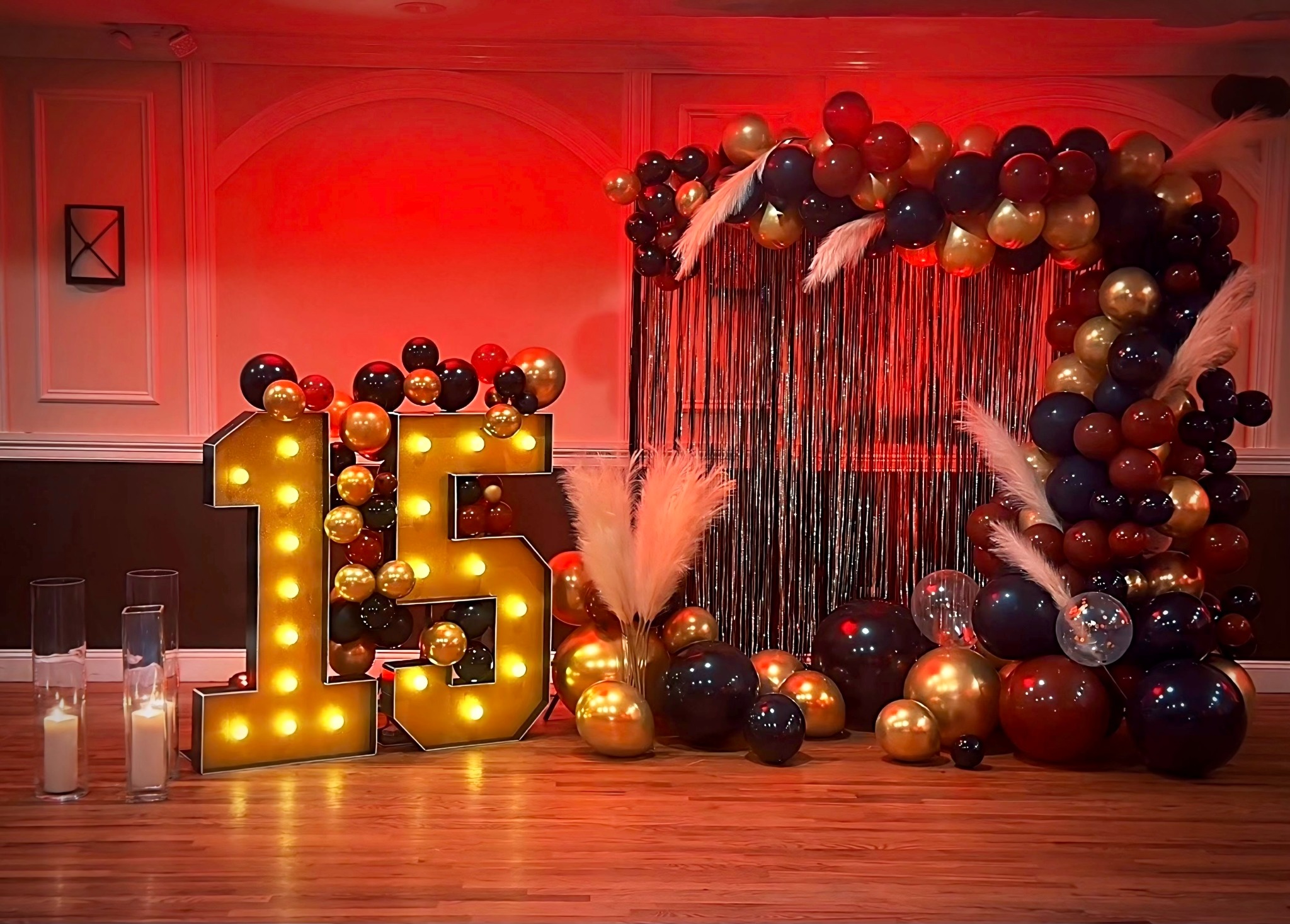 Red & gold balloon garland with marquee '15' numbers