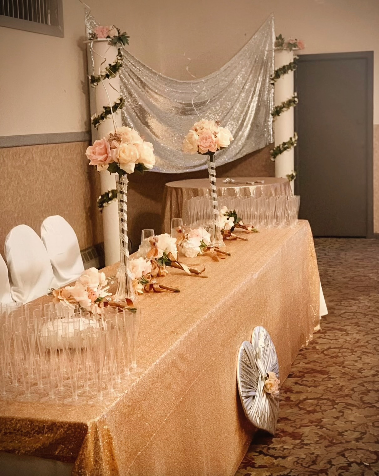 Champagne sequin banquet table with blush florals